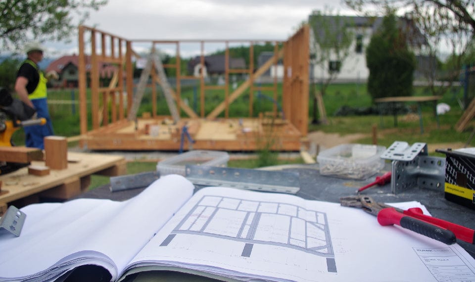 HomeMadeSauna construction site - timber frame with blueprints
